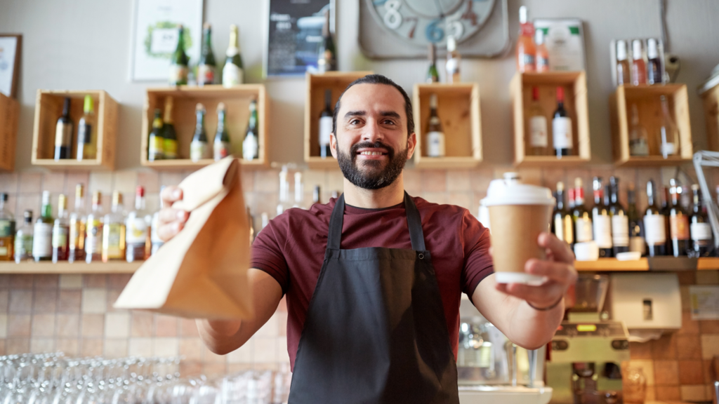 Man passing food to a customer